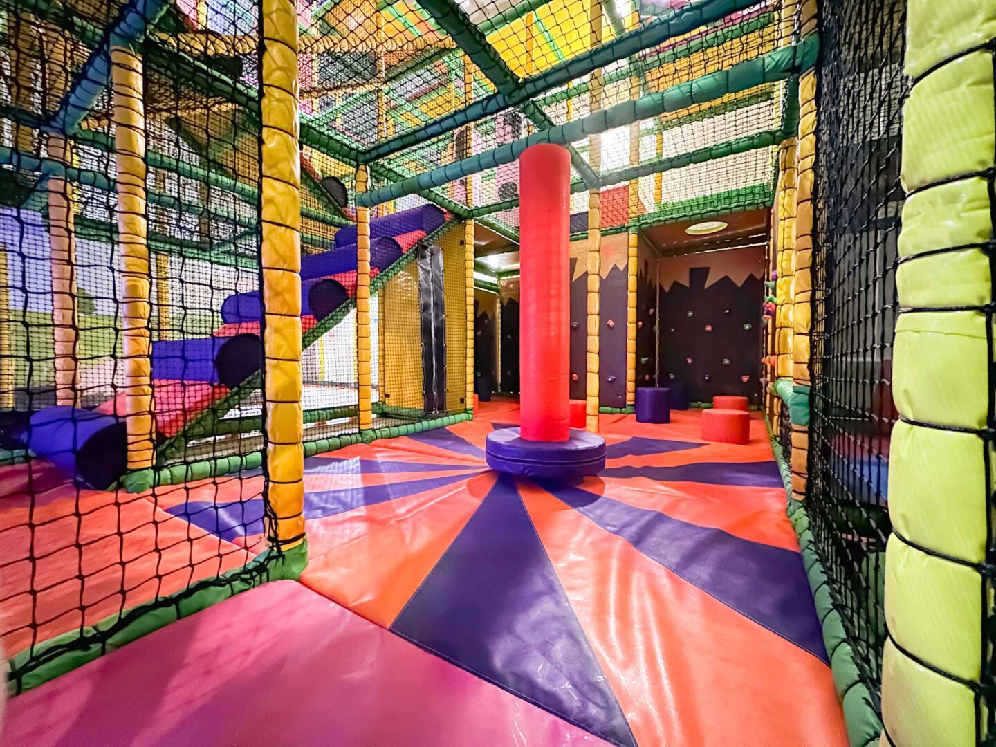 Cannon Hall Farm's Dizzy Disc with Applique Floorboards. The colour scheme for both of these are red and purple. These were both designed and manufactured by Play Creations.
