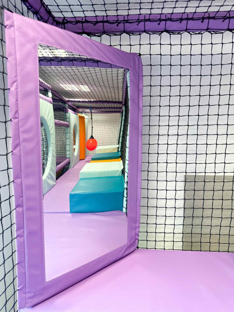 Purple corner window in Trinity Schools indoor softplay area.