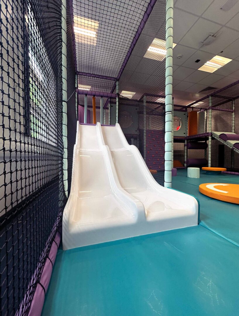 Twin Wavy Slides at Trinity School in Durham, designed by Play Creations Ltd.
