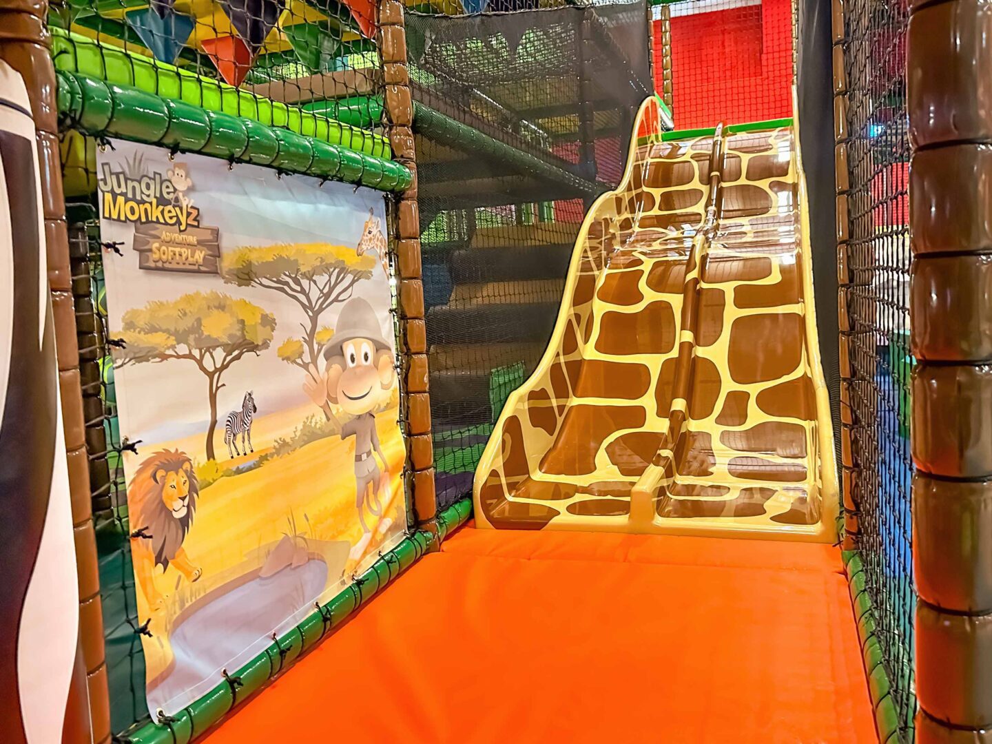 Giraffe themed jungle twin lane slide made for Jungle Monkeyz softplay, designed by Play Creations.