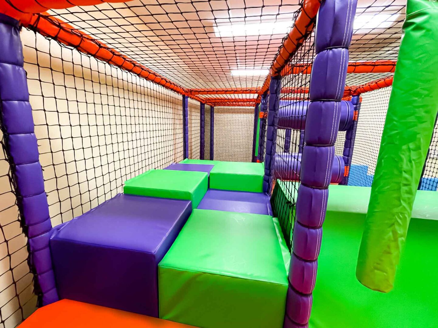 Purple and green cube flooring at St Giles School's indoor softplay area