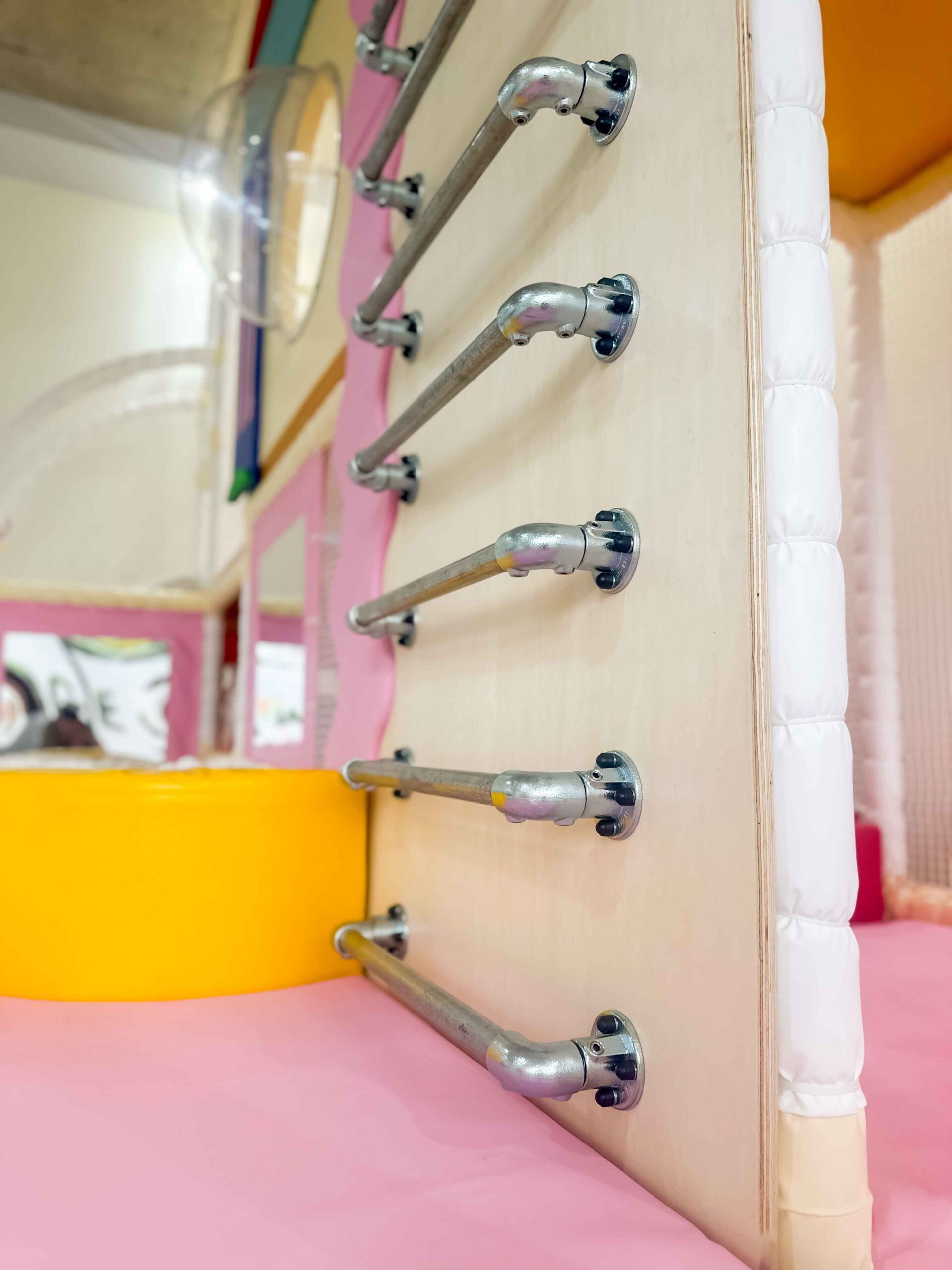 Silver Ladder Climb Panel featuring 6 rungs leading to the top half ot he softplay. Designed by Play Creations.