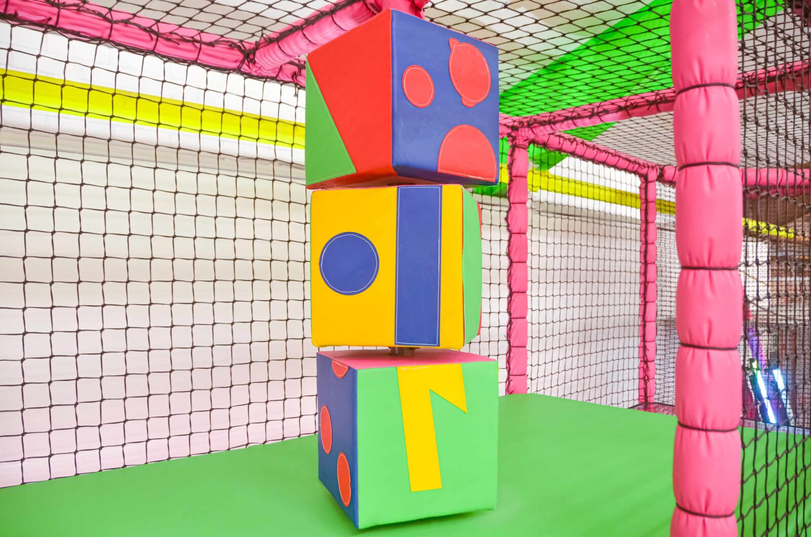 This is the colourful totem pole at the toddler softplay at Fun Factory. The pole is made up of 3 colourful cubes that rotate to show the different faces. There are 4 differnet panels on each cube.