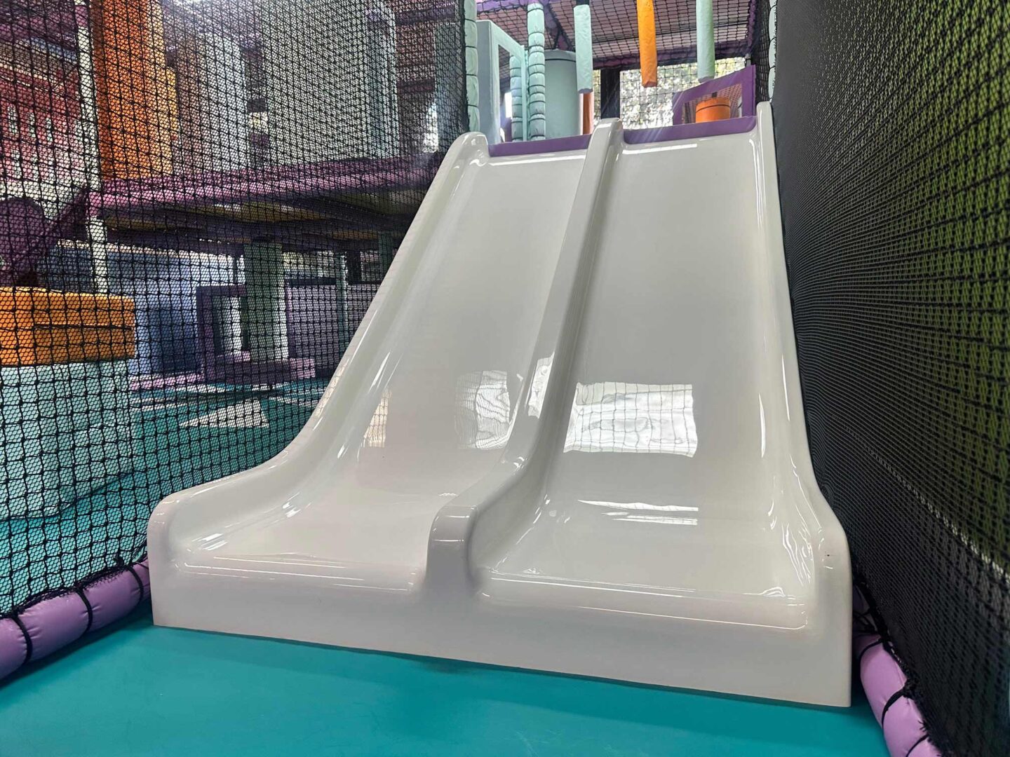 Twin Slides found at Serenity School's softplay designed by Play Creations Ltd.